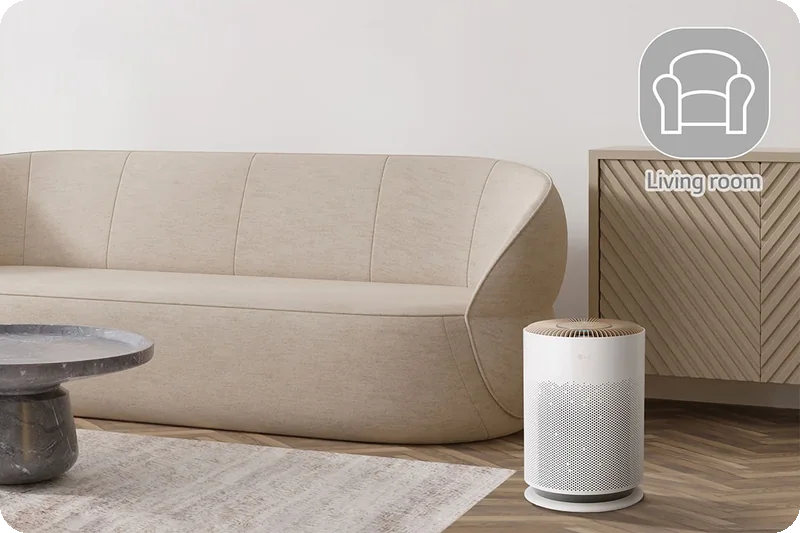 Compact LG PuriCare AS60GHCG0 air purifier in a living room