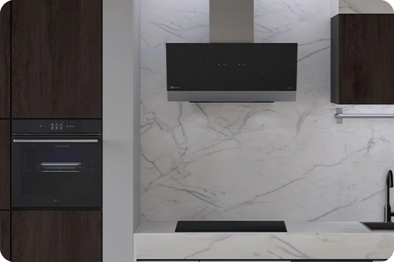 A kitchen with the LG freestanding dishwasher, oven, hood and induction hob installed.