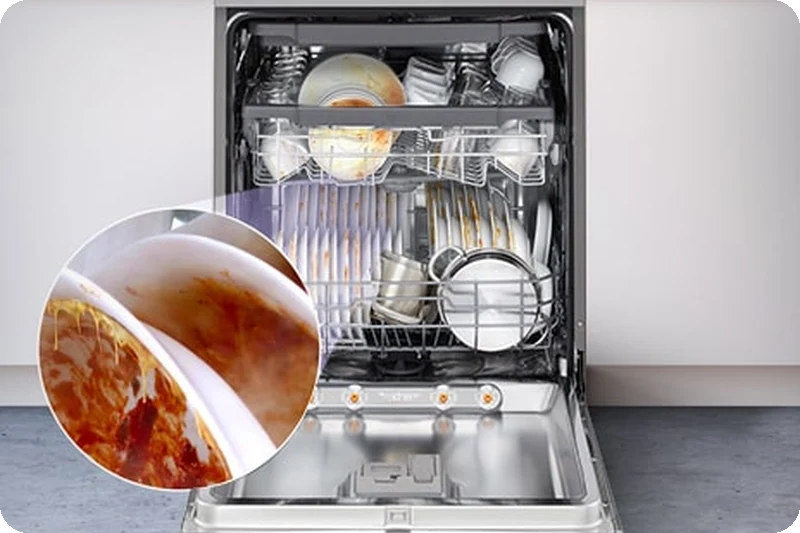 A freestanding dishwasher with the door fully open, revealing dirty dishes inside.