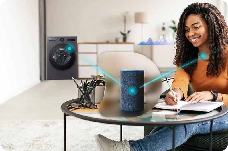 Woman using a smart speaker to control the LG washer dryer.