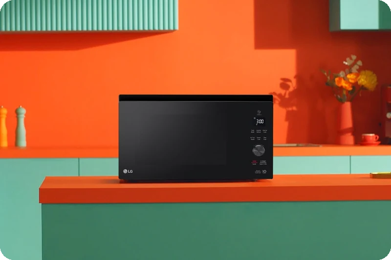 Black LG NeoChef microwave oven placed in a modern kitchen.
